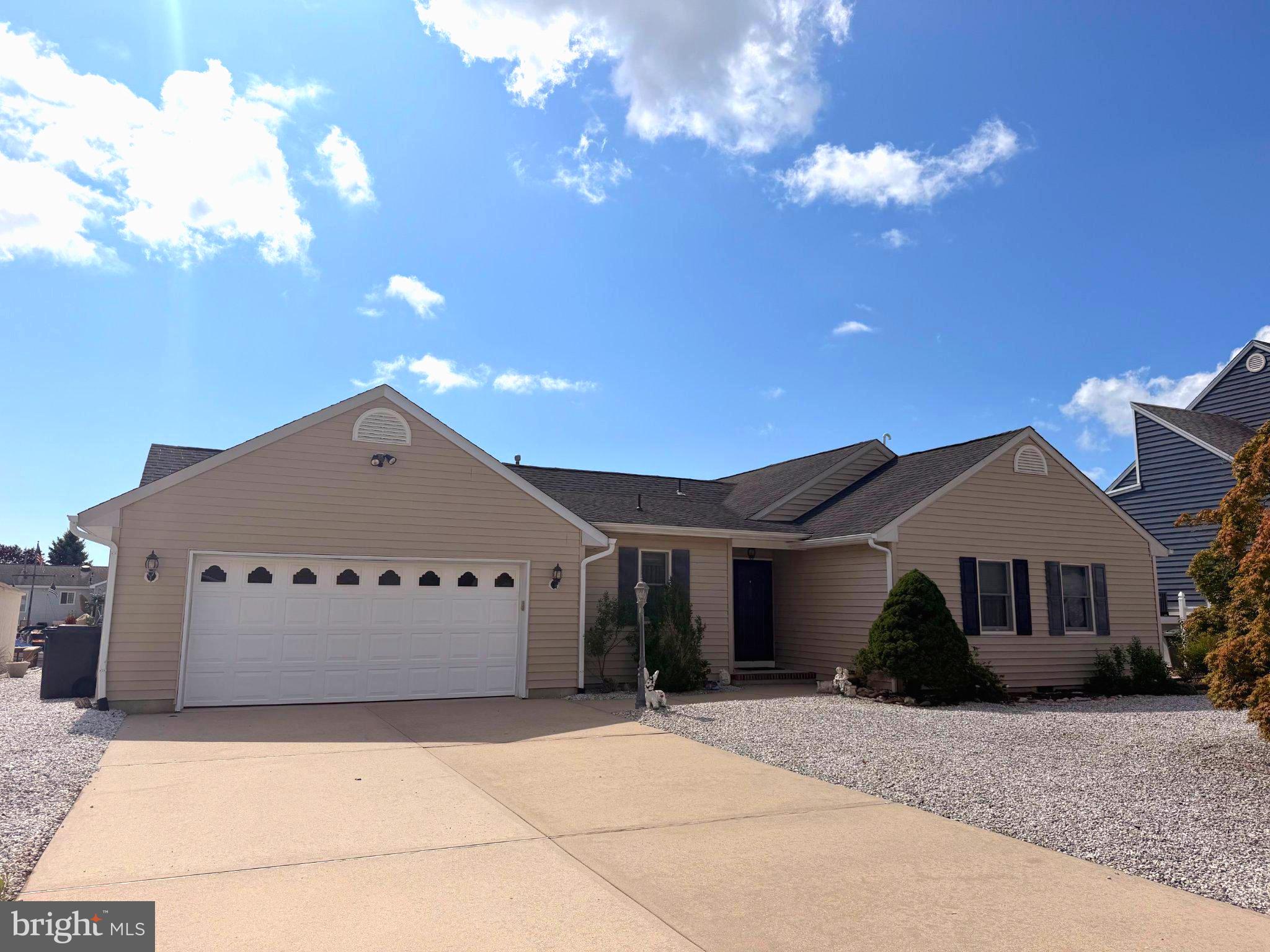 211 William Cook Boulevard Manahawkin, NJ 08050 - Photo 2 of 71 Charming home under a bright sky.