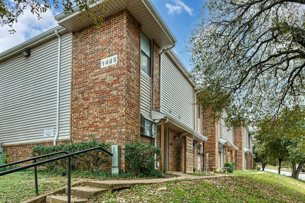 1445 Weiler Boulevard, Unit 1431 Fort Worth, TX 76112 - Photo 1 of 15 a view of a house with a yard