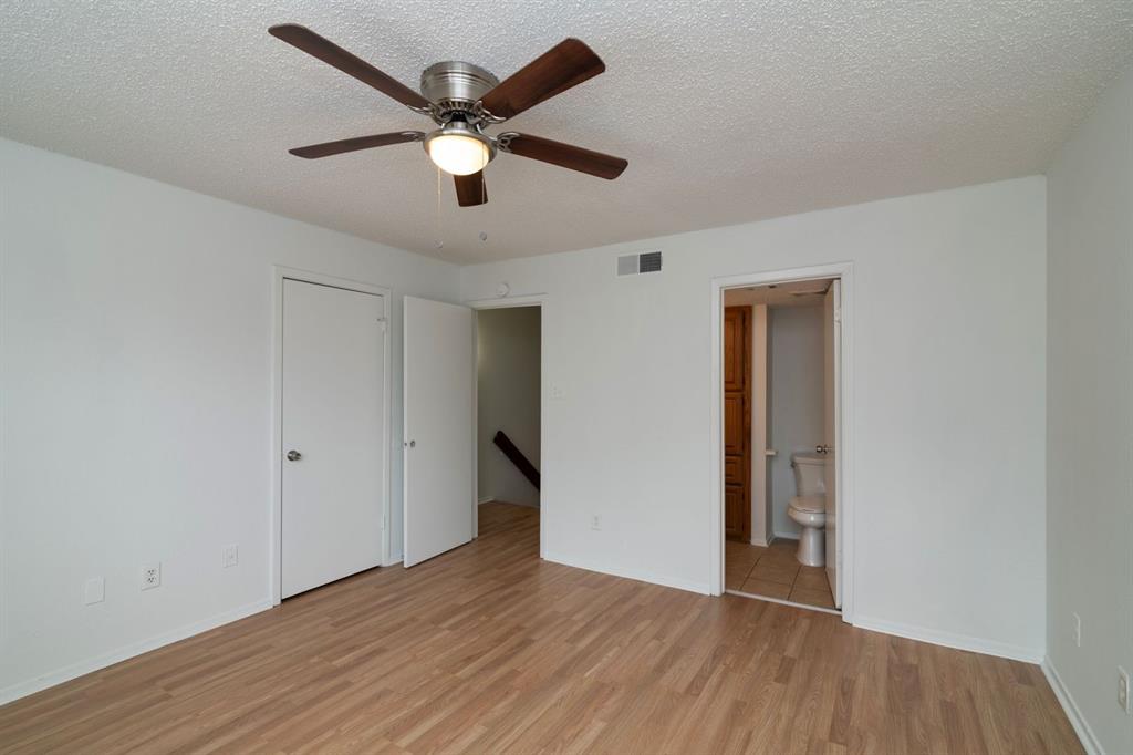 1445 Weiler Boulevard, Unit 1431 Fort Worth, TX 76112 - Photo 11 of 15 a view of an empty room with wooden floor