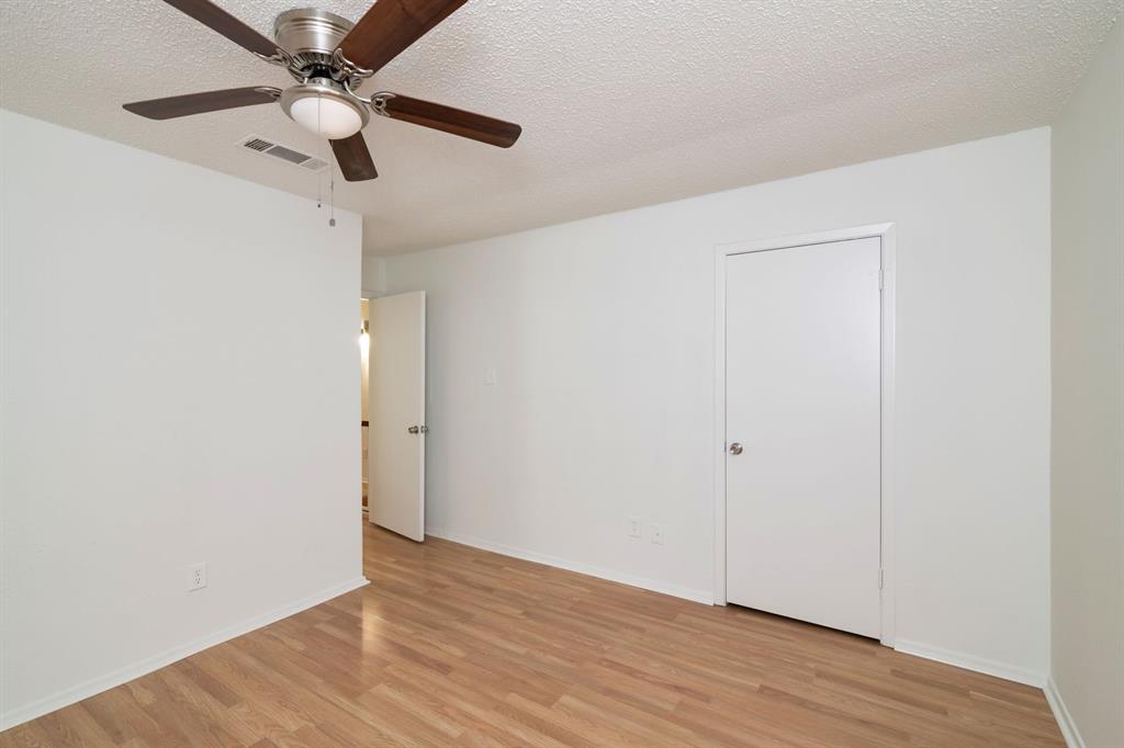 1445 Weiler Boulevard, Unit 1431 Fort Worth, TX 76112 - Photo 13 of 15 wooden floor in an empty room