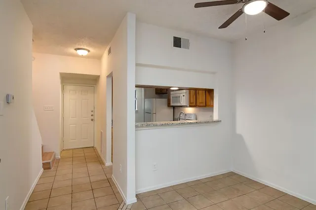 a view of a storage & utility room with a sink