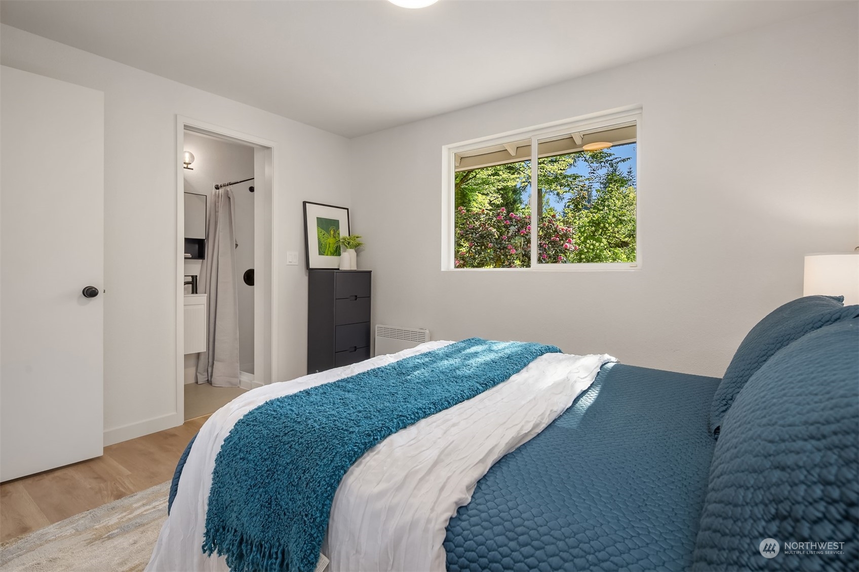 22830 Atlas Road Bothell, WA 98021 - Photo 13 of 40 a bedroom with a bed and a window