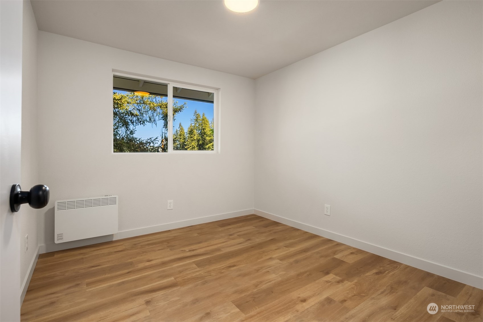 22830 Atlas Road Bothell, WA 98021 - Photo 14 of 40 an empty room with a window