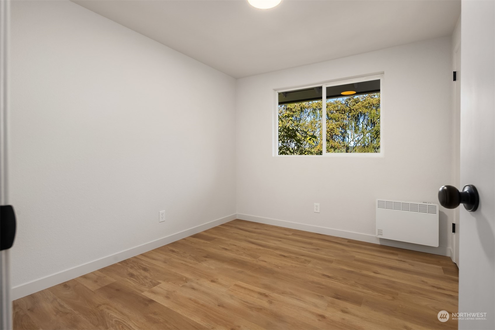 22830 Atlas Road Bothell, WA 98021 - Photo 16 of 40 an empty room with a window