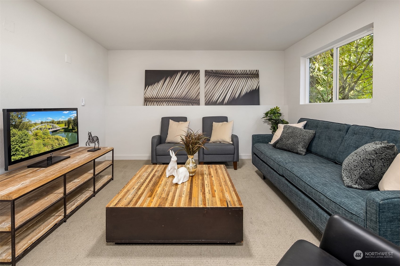 22830 Atlas Road Bothell, WA 98021 - Photo 18 of 40 a living room with furniture and a flat screen tv