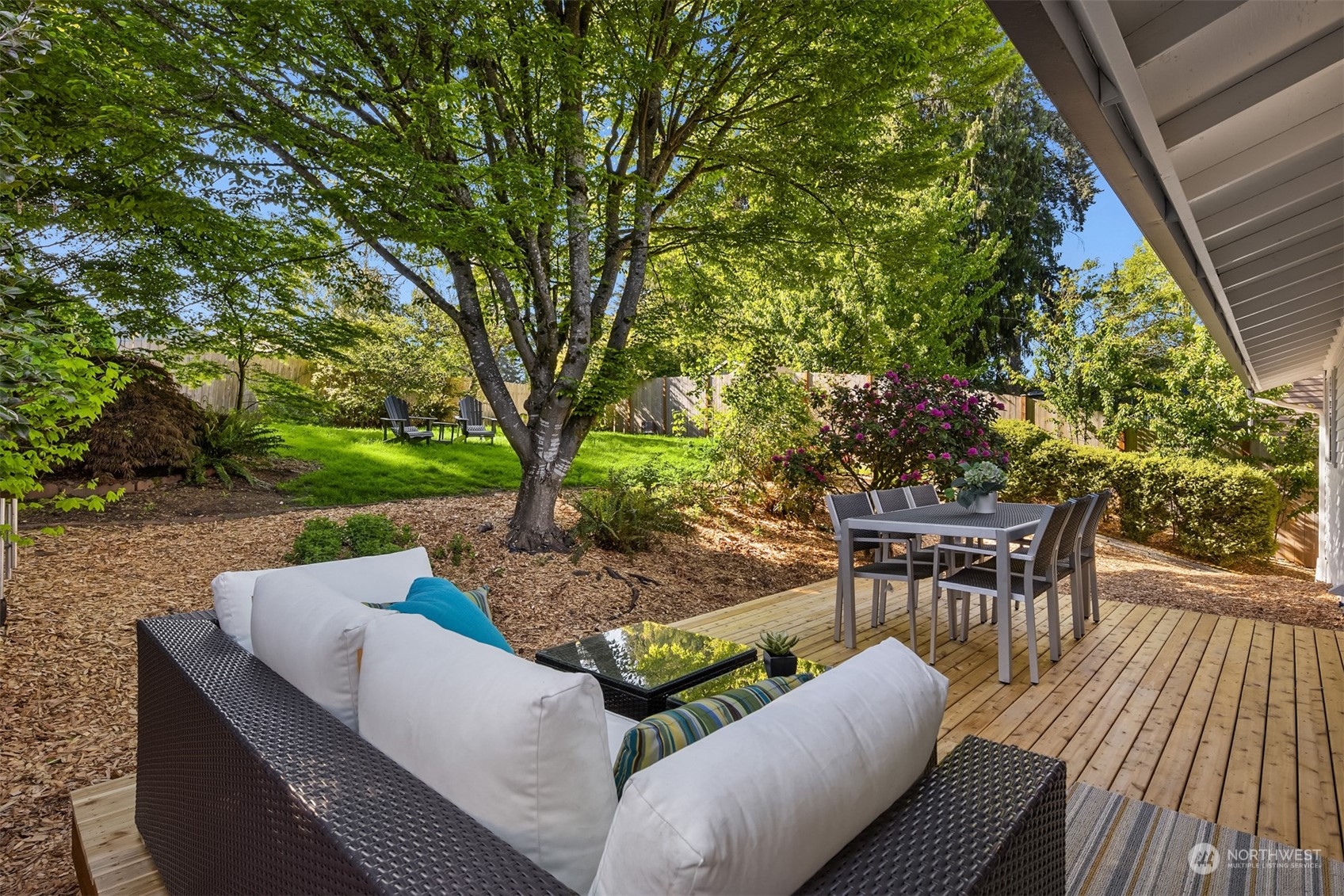 22830 Atlas Road Bothell, WA 98021 - Photo 28 of 40 a view of a patio with couches table and chairs and potted plants