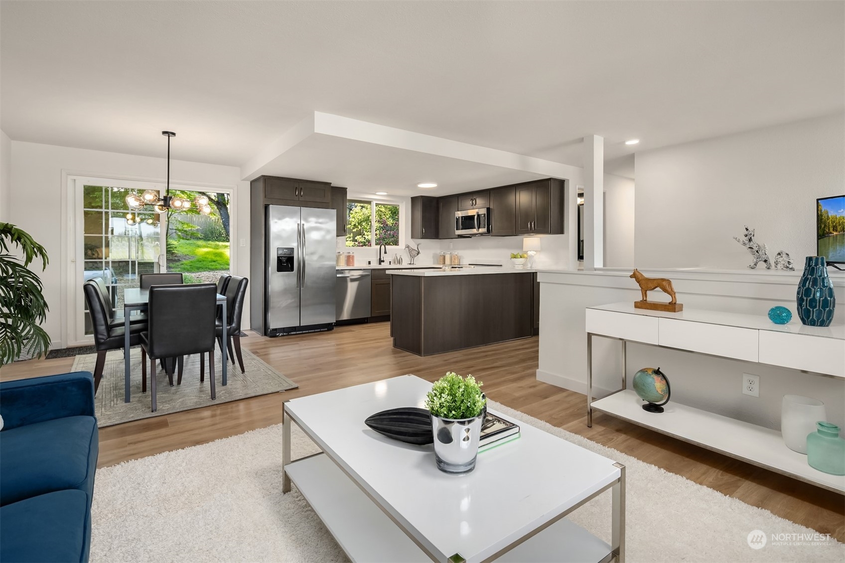 22830 Atlas Road Bothell, WA 98021 - Photo 3 of 40 a kitchen with a table and chairs in it