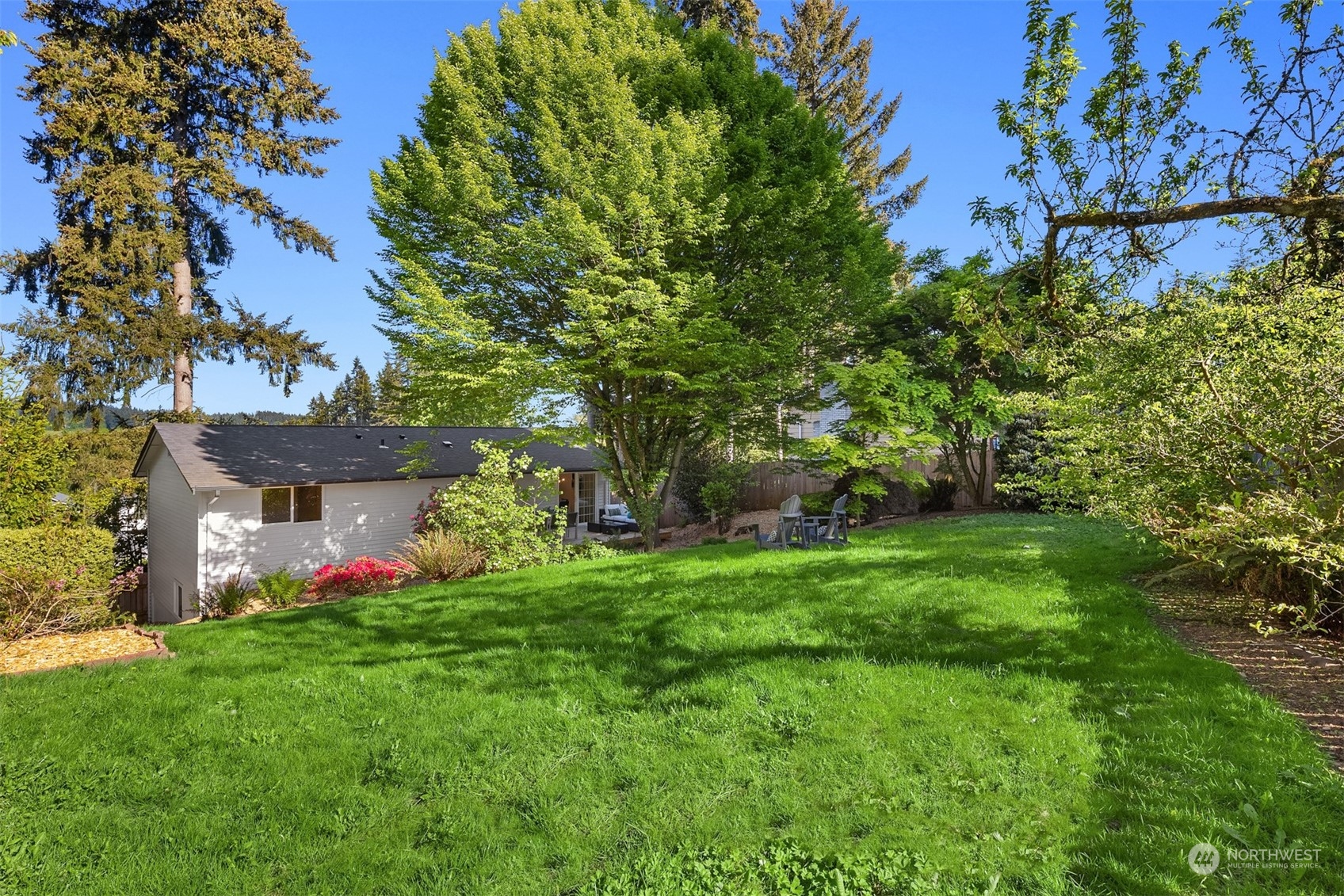 22830 Atlas Road Bothell, WA 98021 - Photo 32 of 40 a view of a house with a garden