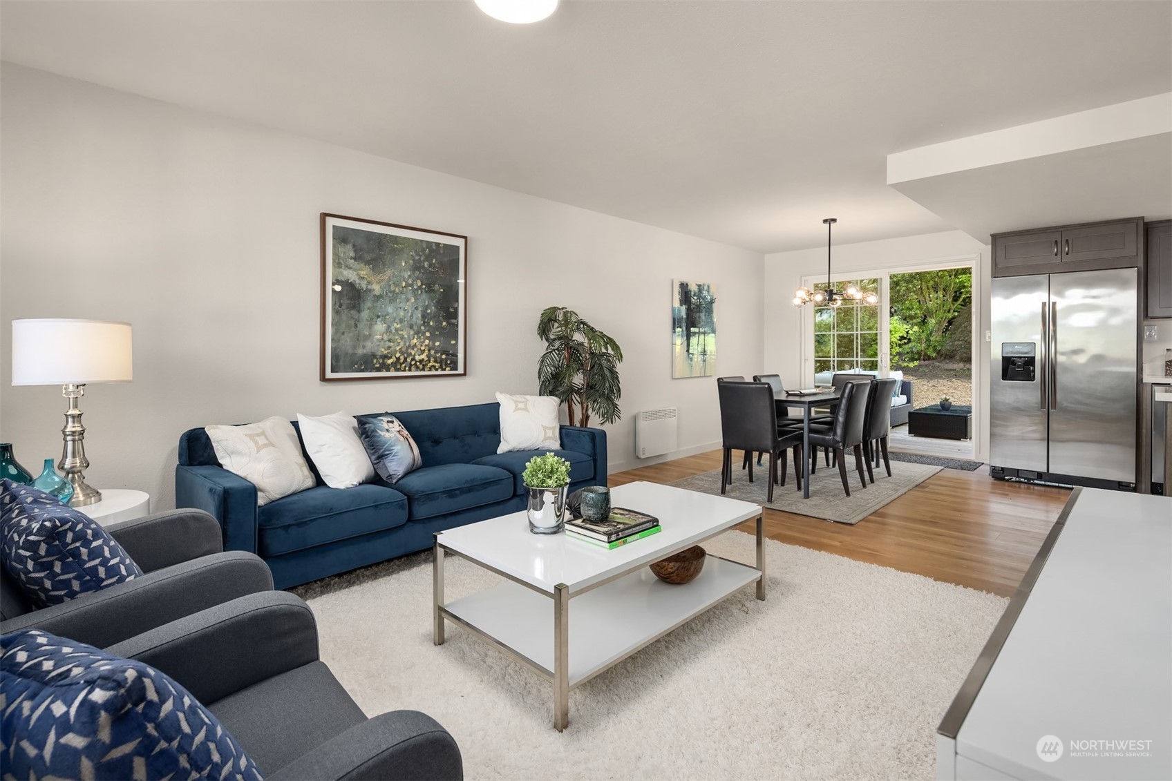22830 Atlas Road Bothell, WA 98021 - Photo 6 of 40 a living room with furniture and wooden floor