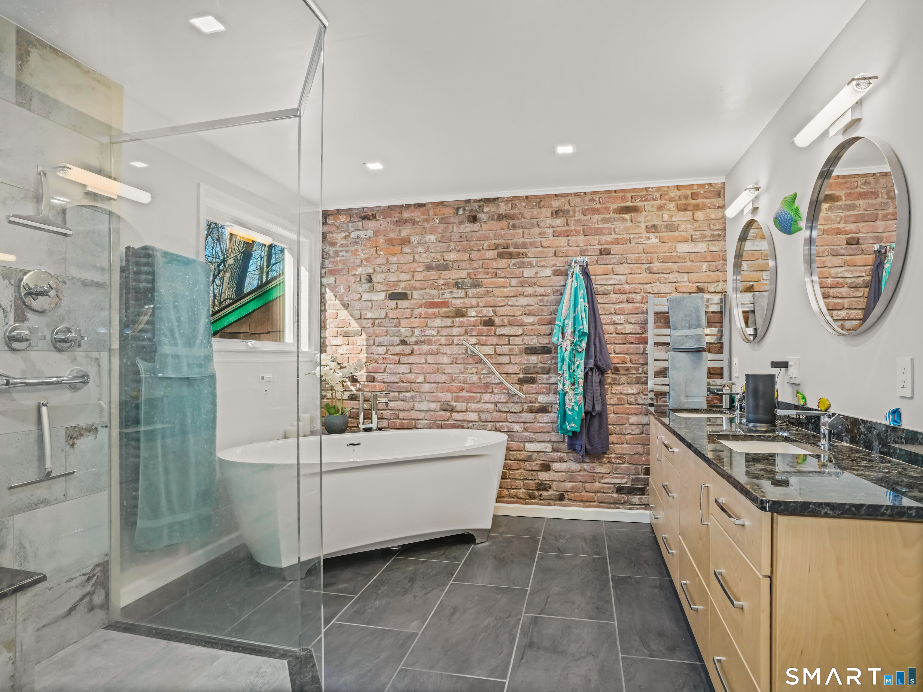 208 Cascade Road Stamford, CT 06903 - Photo 17 of 31 a bathroom with a tub sink and mirror