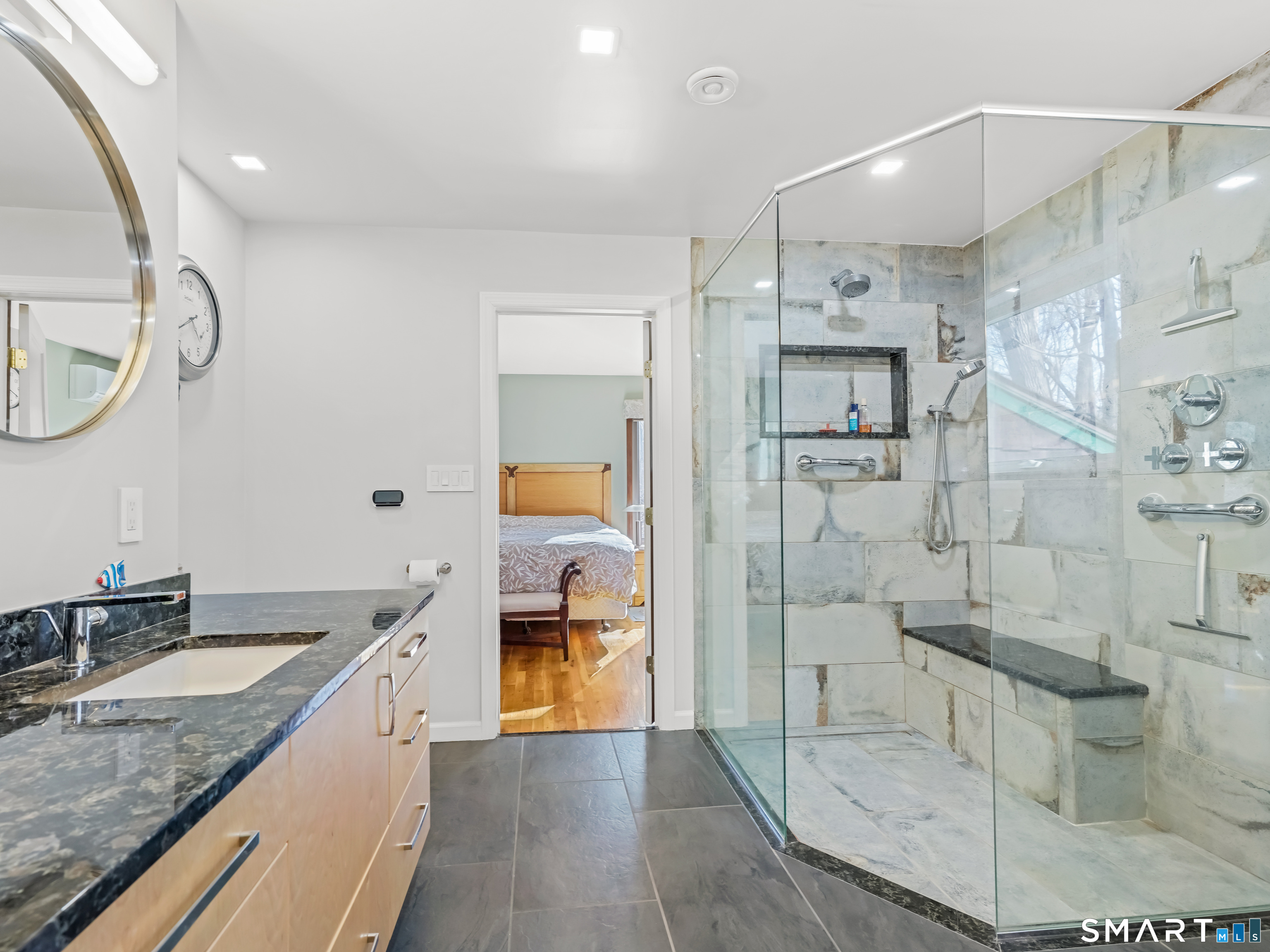 208 Cascade Road Stamford, CT 06903 - Photo 18 of 31 a spacious bathroom with a granite countertop sink mirror and shower