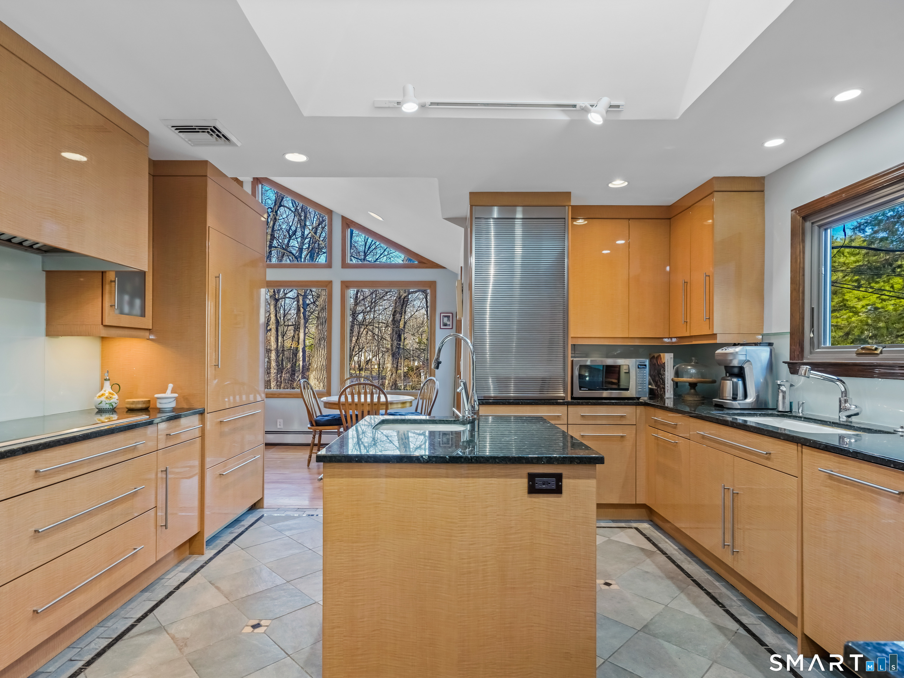 208 Cascade Road Stamford, CT 06903 - Photo 4 of 31 a kitchen with granite countertop a sink and cabinets