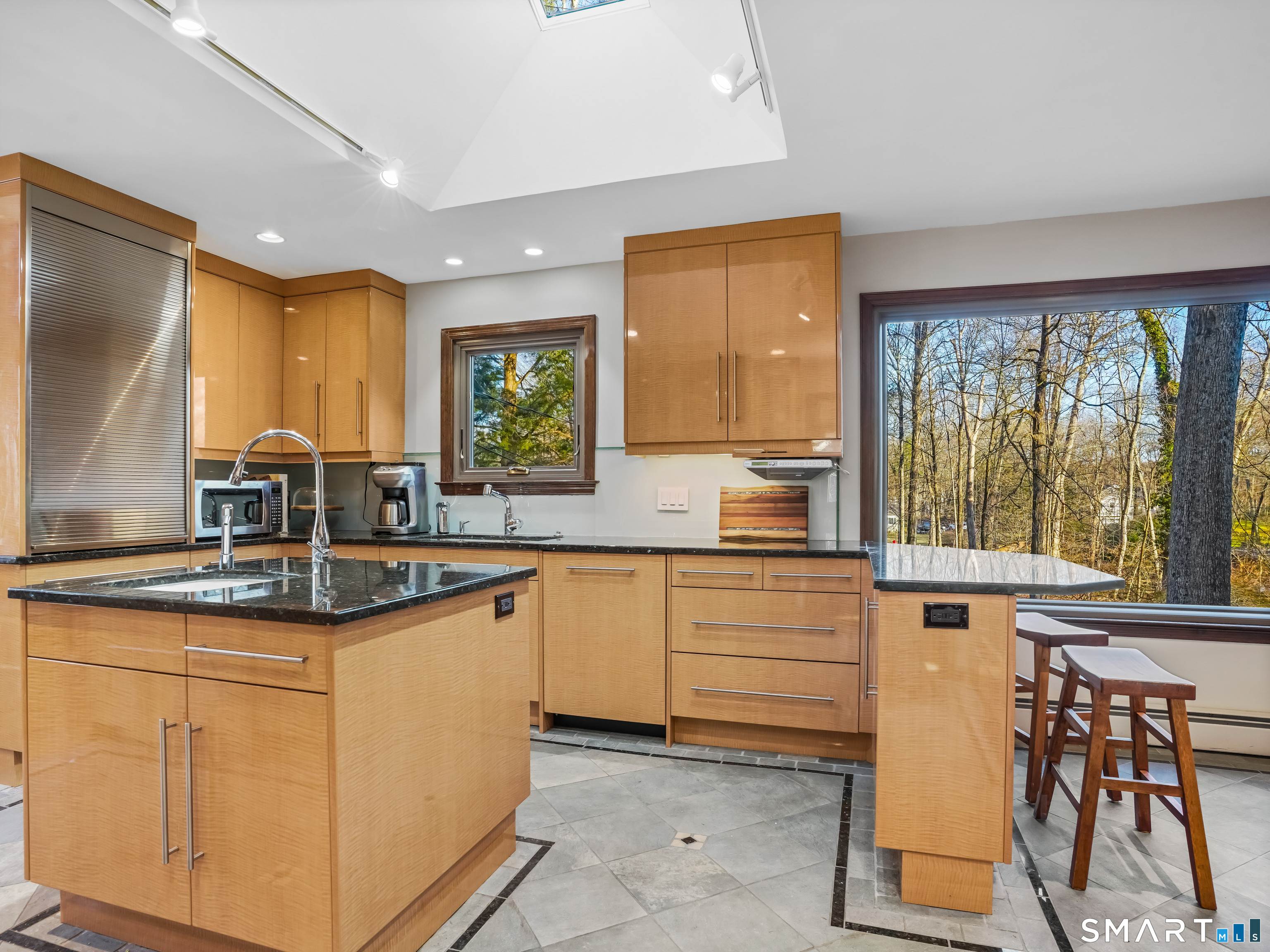 208 Cascade Road Stamford, CT 06903 - Photo 5 of 31 a kitchen with a sink and cabinets