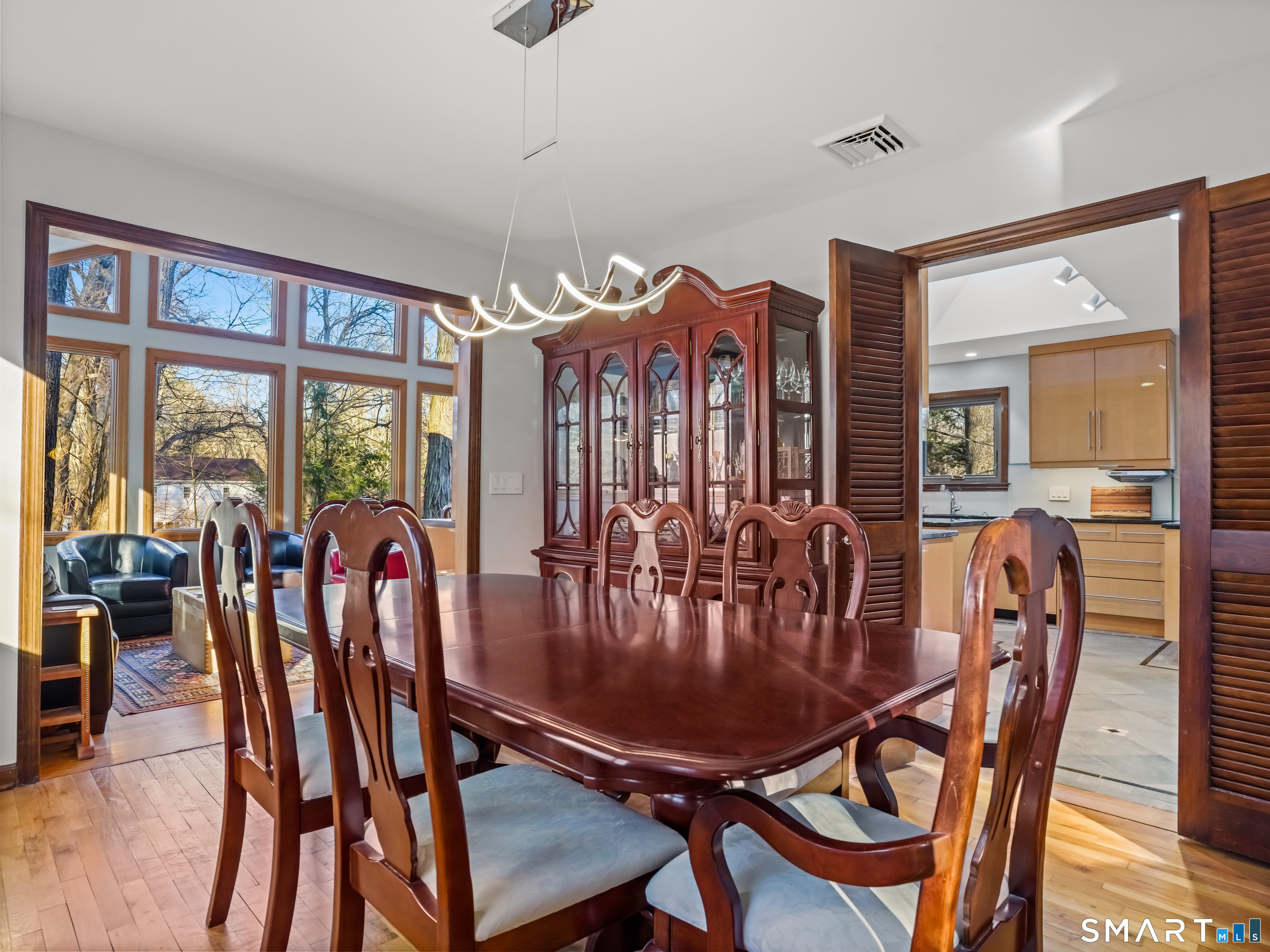 208 Cascade Road Stamford, CT 06903 - Photo 7 of 31 a view of a dining room with furniture window and wooden floor