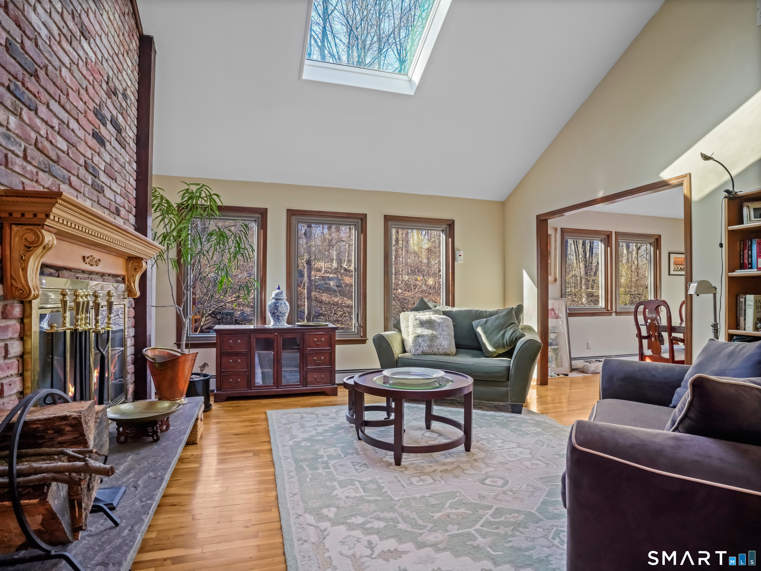 208 Cascade Road Stamford, CT 06903 - Photo 8 of 31 a living room with furniture and a fireplace