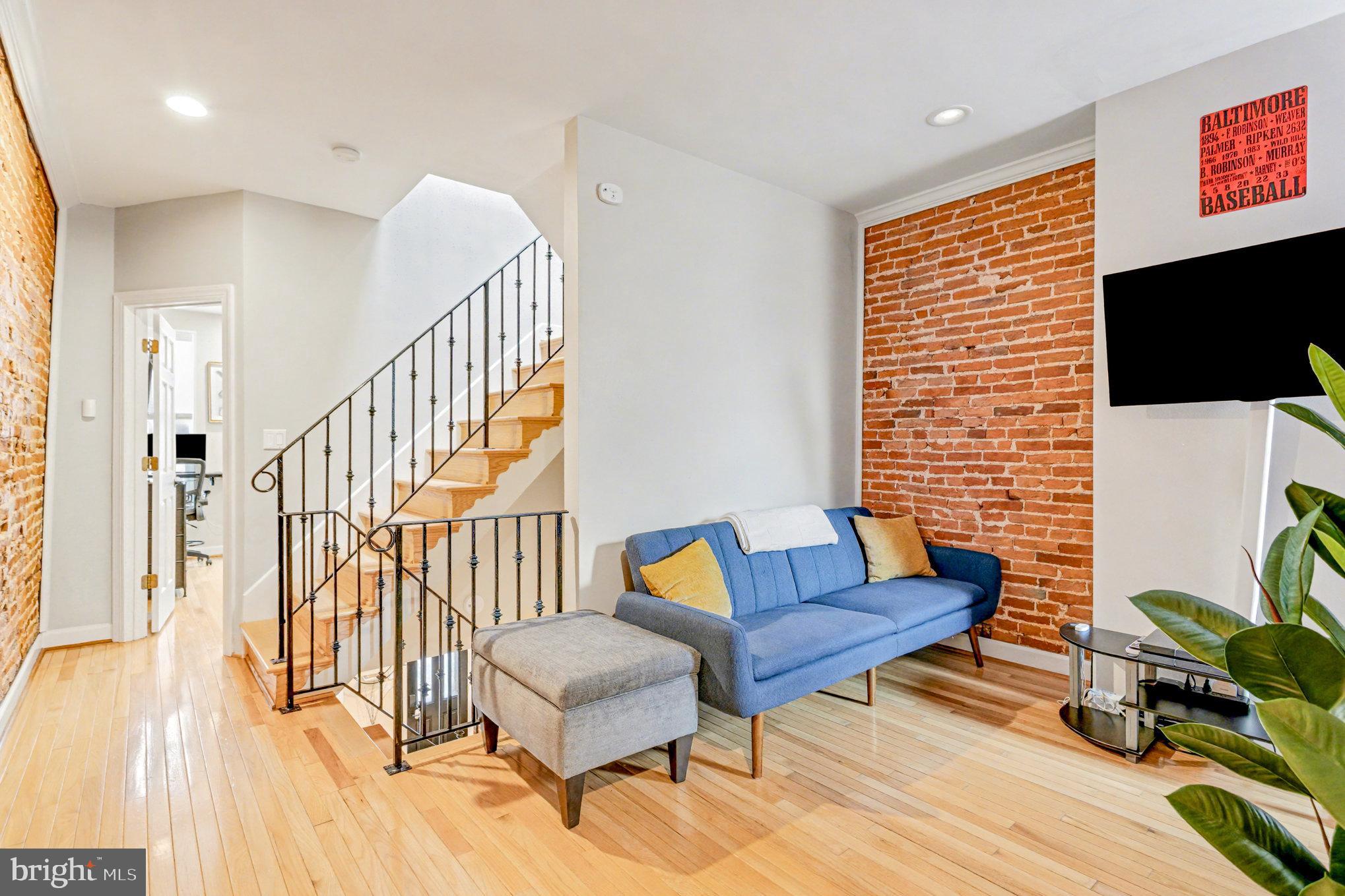 1314 South Hanover Street Baltimore, MD 21230 - Photo 15 of 30 a living room with furniture and a wooden floor