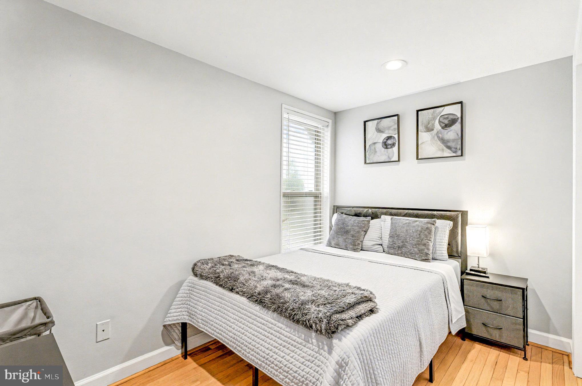 1314 South Hanover Street Baltimore, MD 21230 - Photo 18 of 30 a bedroom with a bed and a window