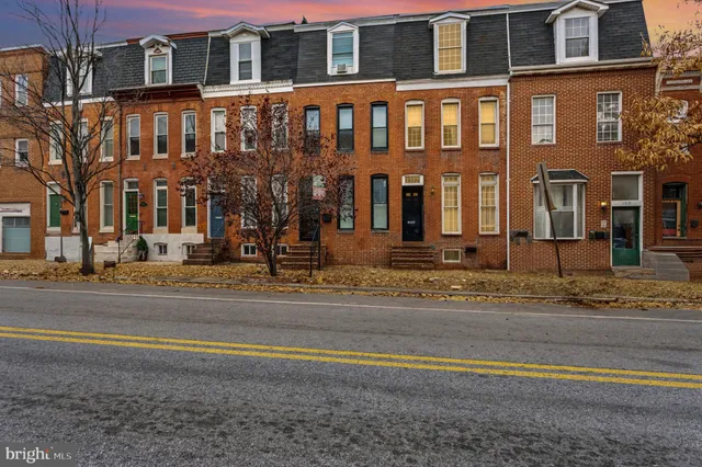 a front view of a building with a street