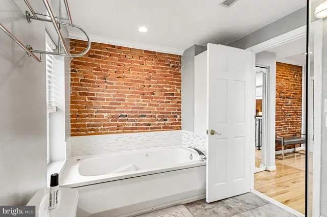 a bathroom with a bathtub and a shower