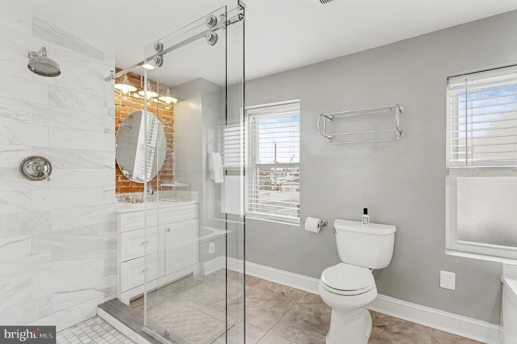 1314 South Hanover Street Baltimore, MD 21230 - Photo 27 of 30 a bathroom with a toilet sink and shower