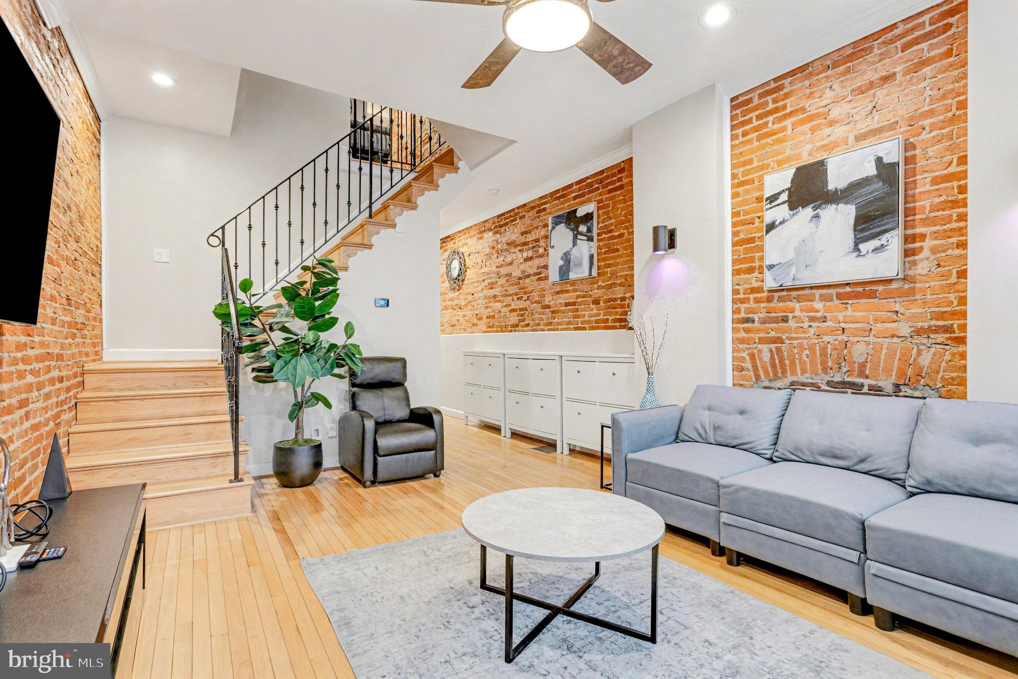 1314 South Hanover Street Baltimore, MD 21230 - Photo 4 of 30 a living room with furniture and a potted plant