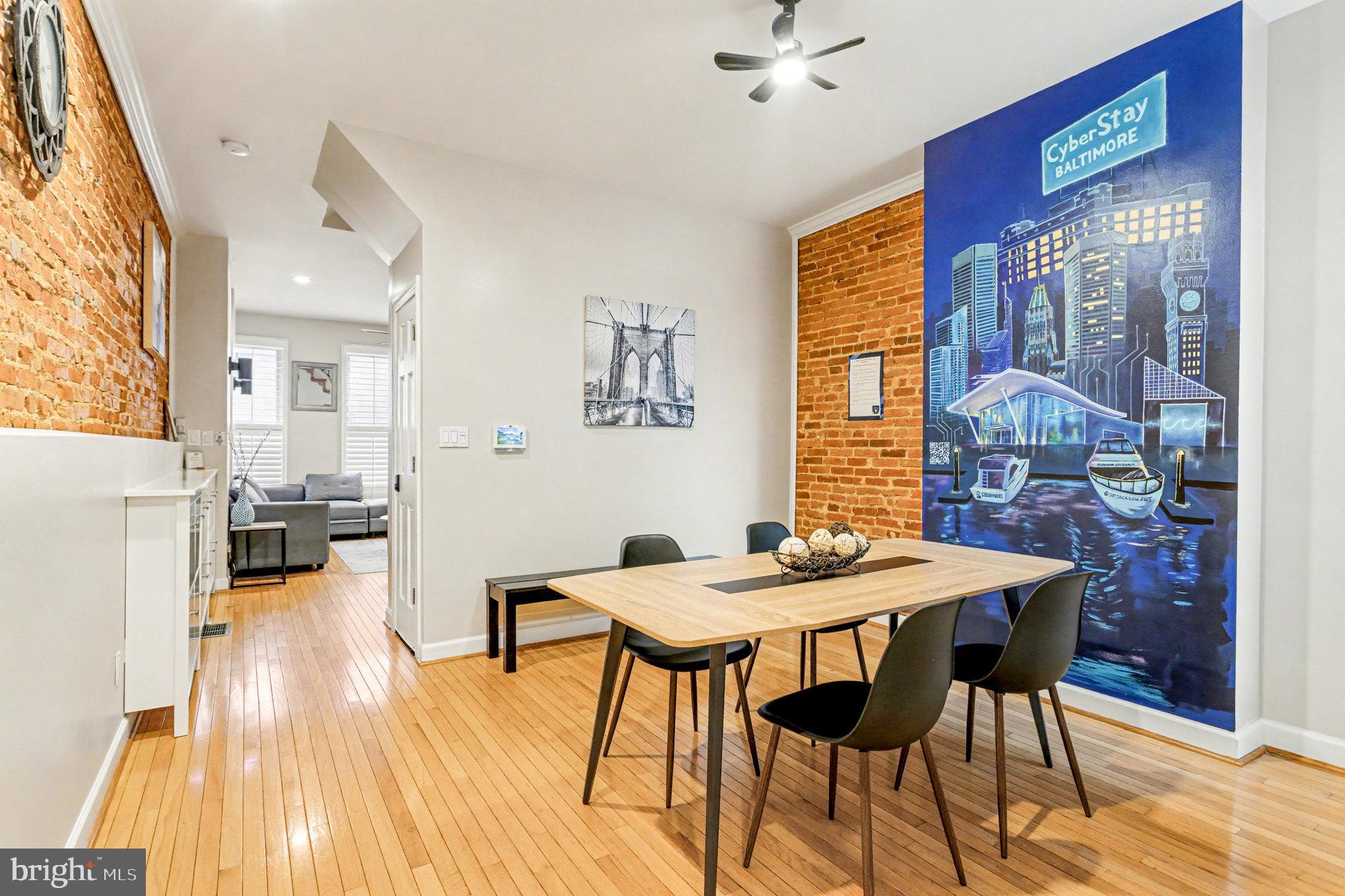 1314 South Hanover Street Baltimore, MD 21230 - Photo 6 of 30 a view of a dining room with furniture and wooden floor
