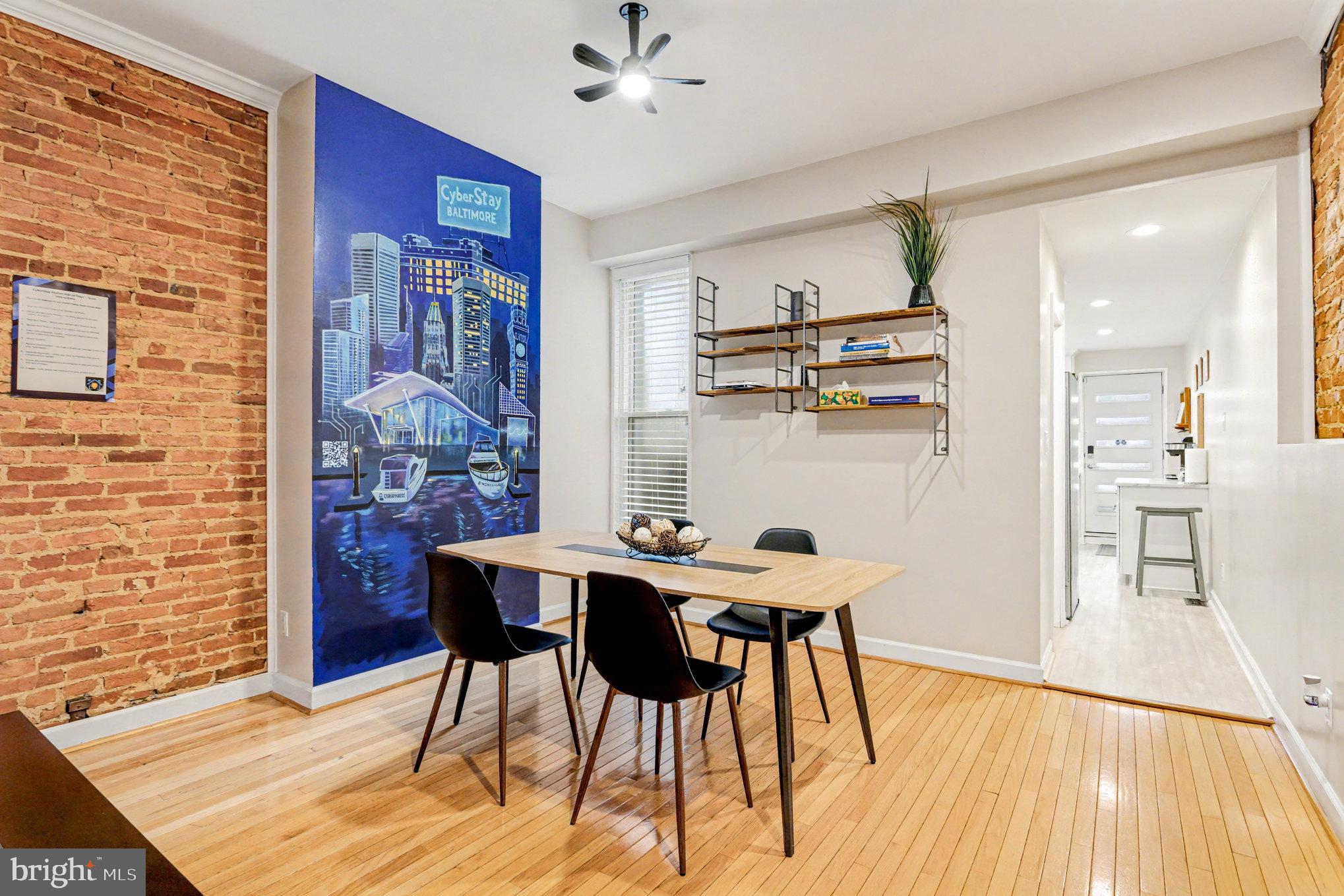 1314 South Hanover Street Baltimore, MD 21230 - Photo 7 of 30 a view of a dining room with furniture and wooden floor