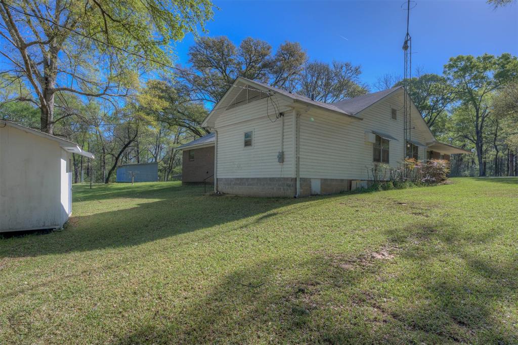 314 Dilly Road Mooringsport, LA 71060 - Photo 13 of 37 a view of a house with backyard and trees