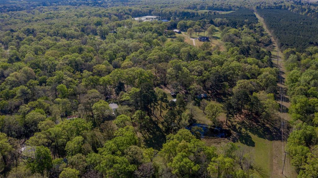 314 Dilly Road Mooringsport, LA 71060 - Photo 37 of 37 an aerial view of residential house with outdoor space and trees all around