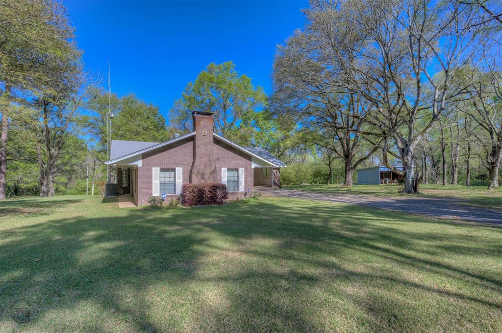 314 Dilly Road Mooringsport, LA 71060 - Photo 10 of 37 a house view with a garden space