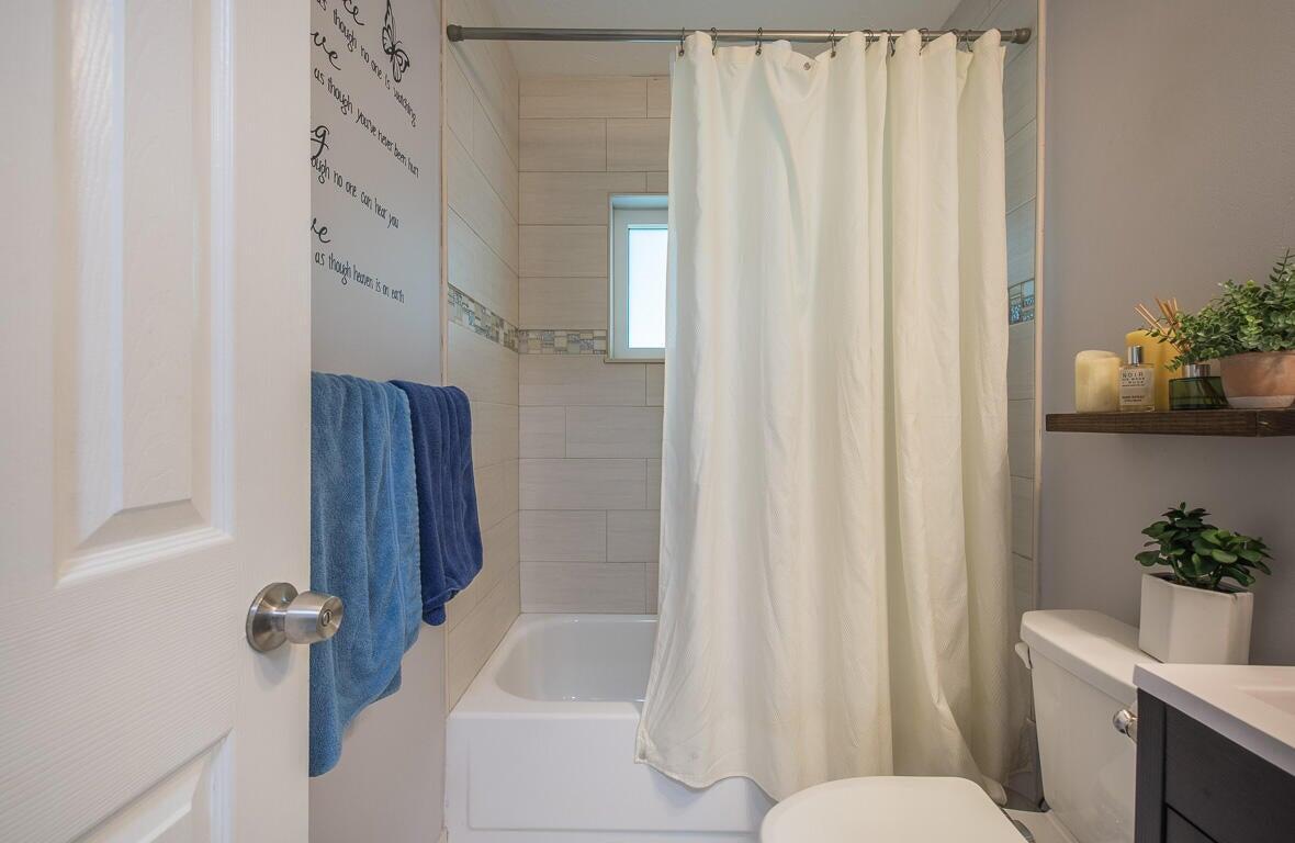 4244 Appalachian Street Boca Raton, FL 33428 - Photo 20 of 25 a bathroom with a sink toilet and shower