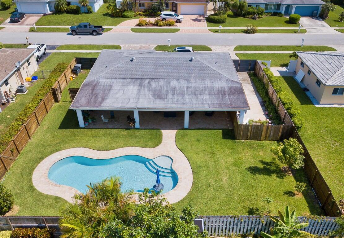 4244 Appalachian Street Boca Raton, FL 33428 - Photo 2 of 25 a aerial view of a swimming pool with a yard