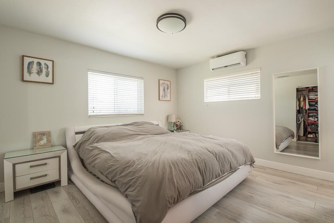 4244 Appalachian Street Boca Raton, FL 33428 - Photo 23 of 25 a bedroom with a bed and a window