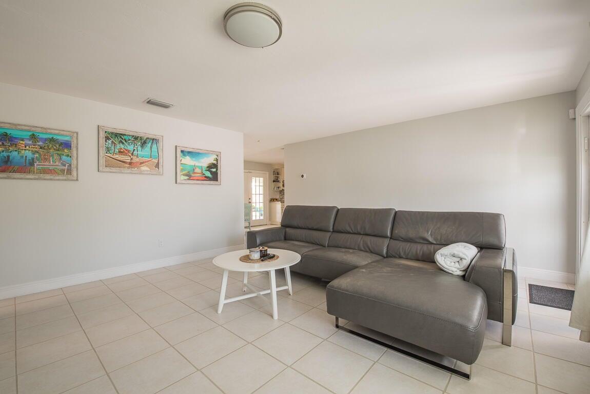 4244 Appalachian Street Boca Raton, FL 33428 - Photo 24 of 25 a living room with furniture and a wooden floor