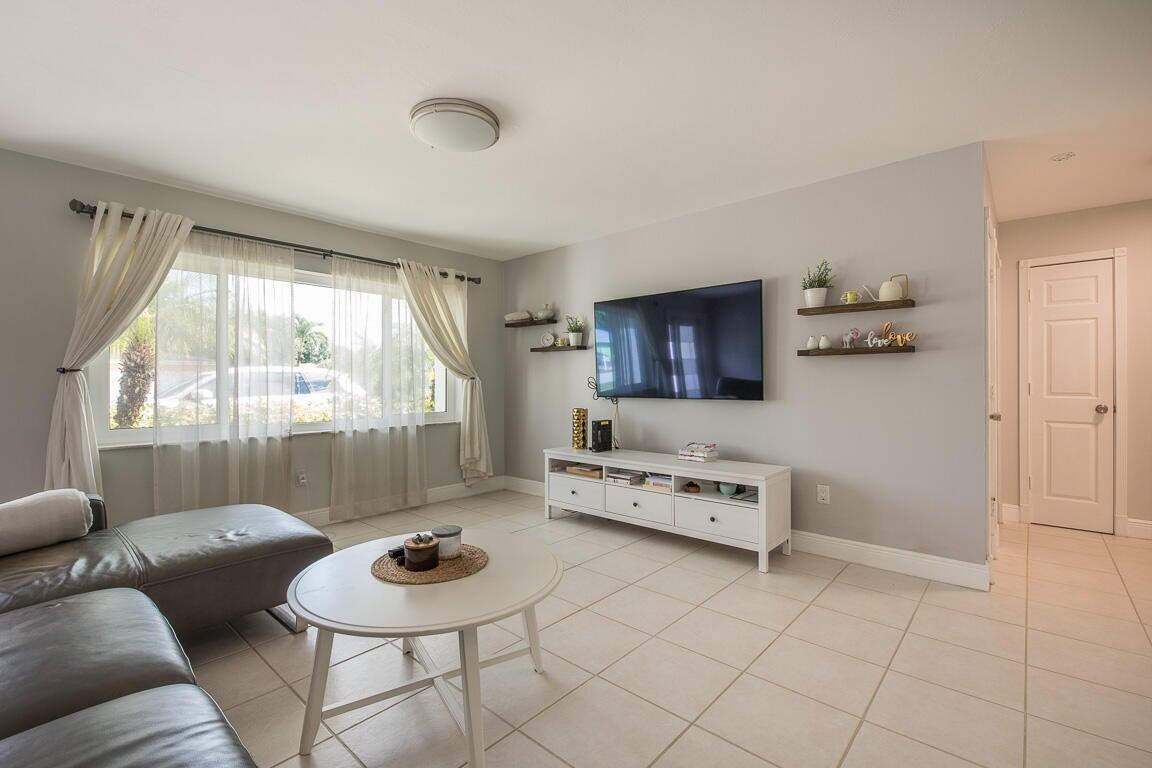 4244 Appalachian Street Boca Raton, FL 33428 - Photo 25 of 25 a living room with furniture and a table