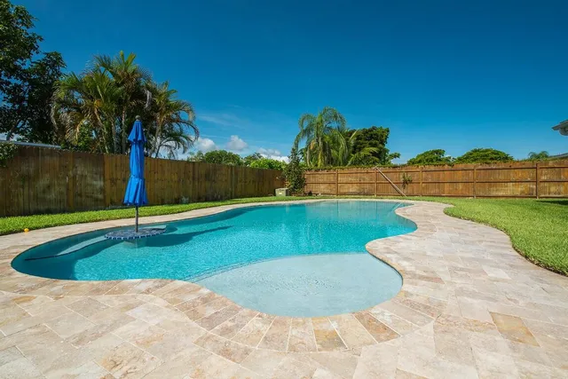a view of outdoor space yard and swimming pool