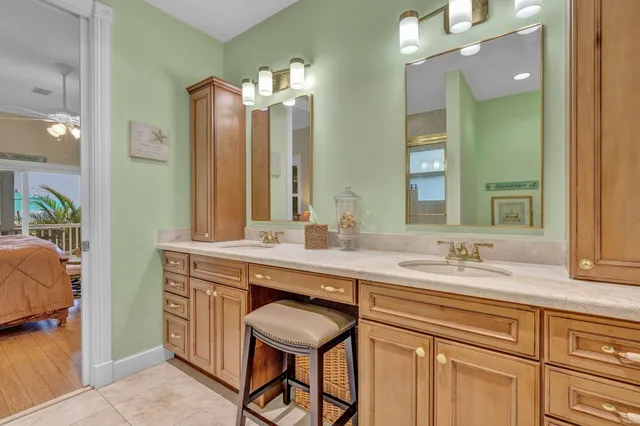 a bathroom with a sink double vanity and a mirror