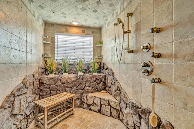 a bathroom with a bathtub and shower