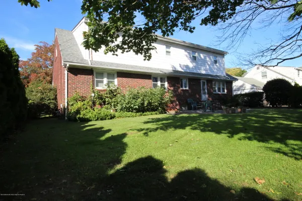 a view of a house with garden and plants