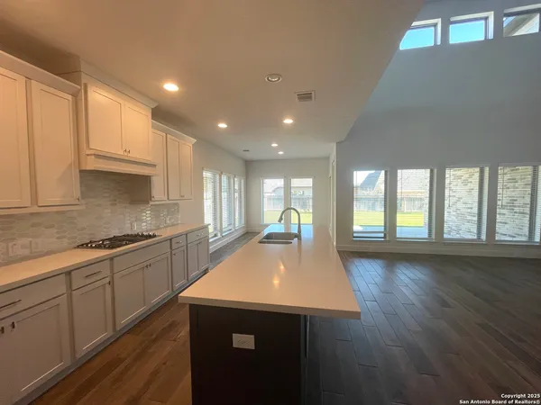 a kitchen with a stove and a refrigerator