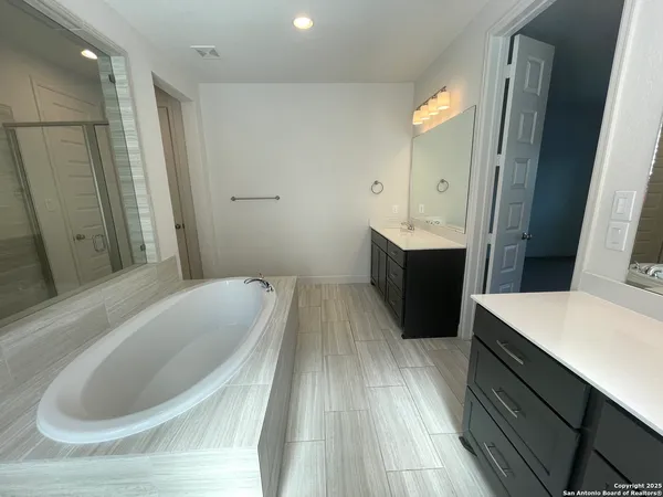 a view of a livingroom with furniture and staircase