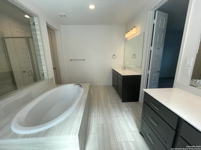 a view of a livingroom with furniture and staircase