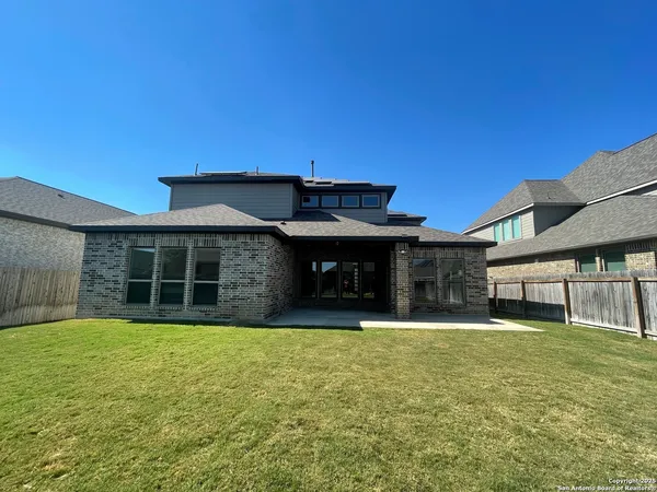 a view of a livingroom with a ceiling fan and window