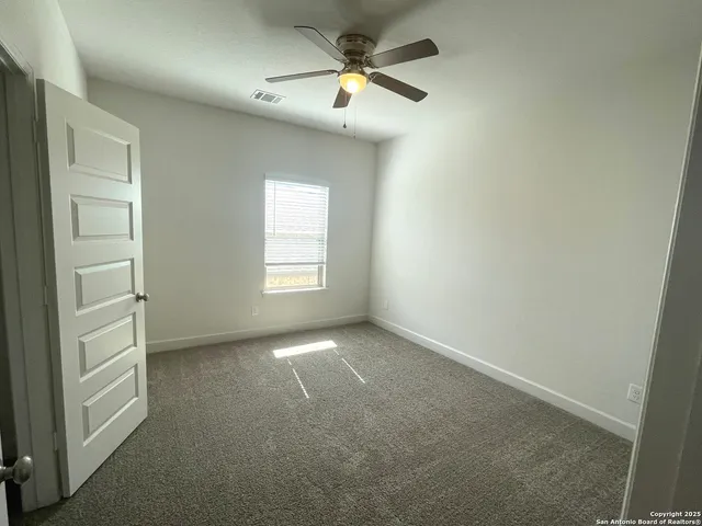 a bathroom with a bathtub sink and mirror