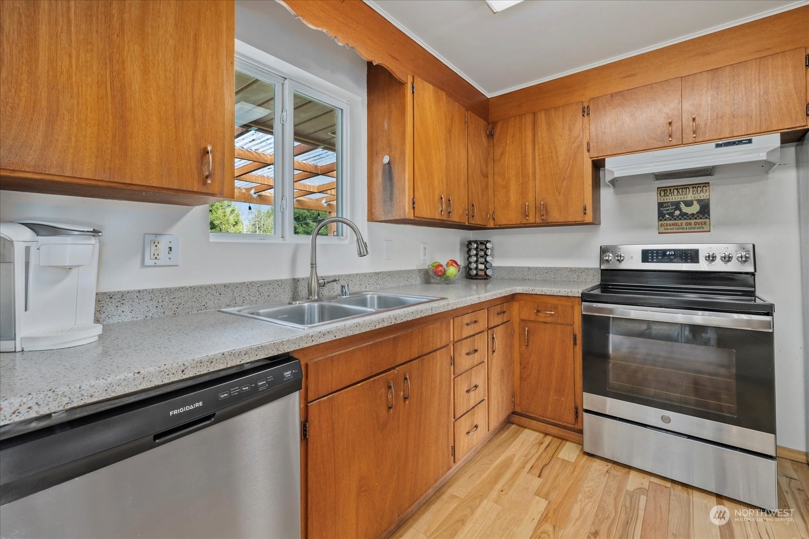 13925 Dubuque Road Snohomish, WA 98290 - Photo 12 of 40 a kitchen with stainless steel appliances granite countertop a sink stove and cabinets