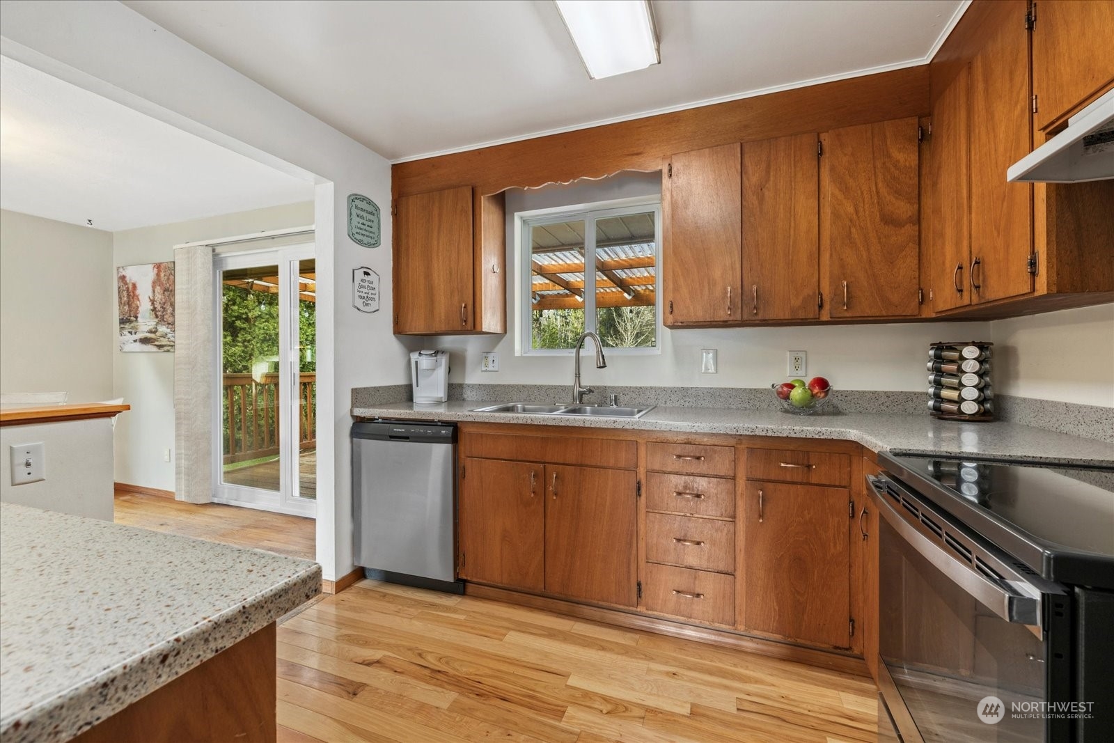 13925 Dubuque Road Snohomish, WA 98290 - Photo 13 of 40 a kitchen with stainless steel appliances granite countertop a sink stove and cabinets