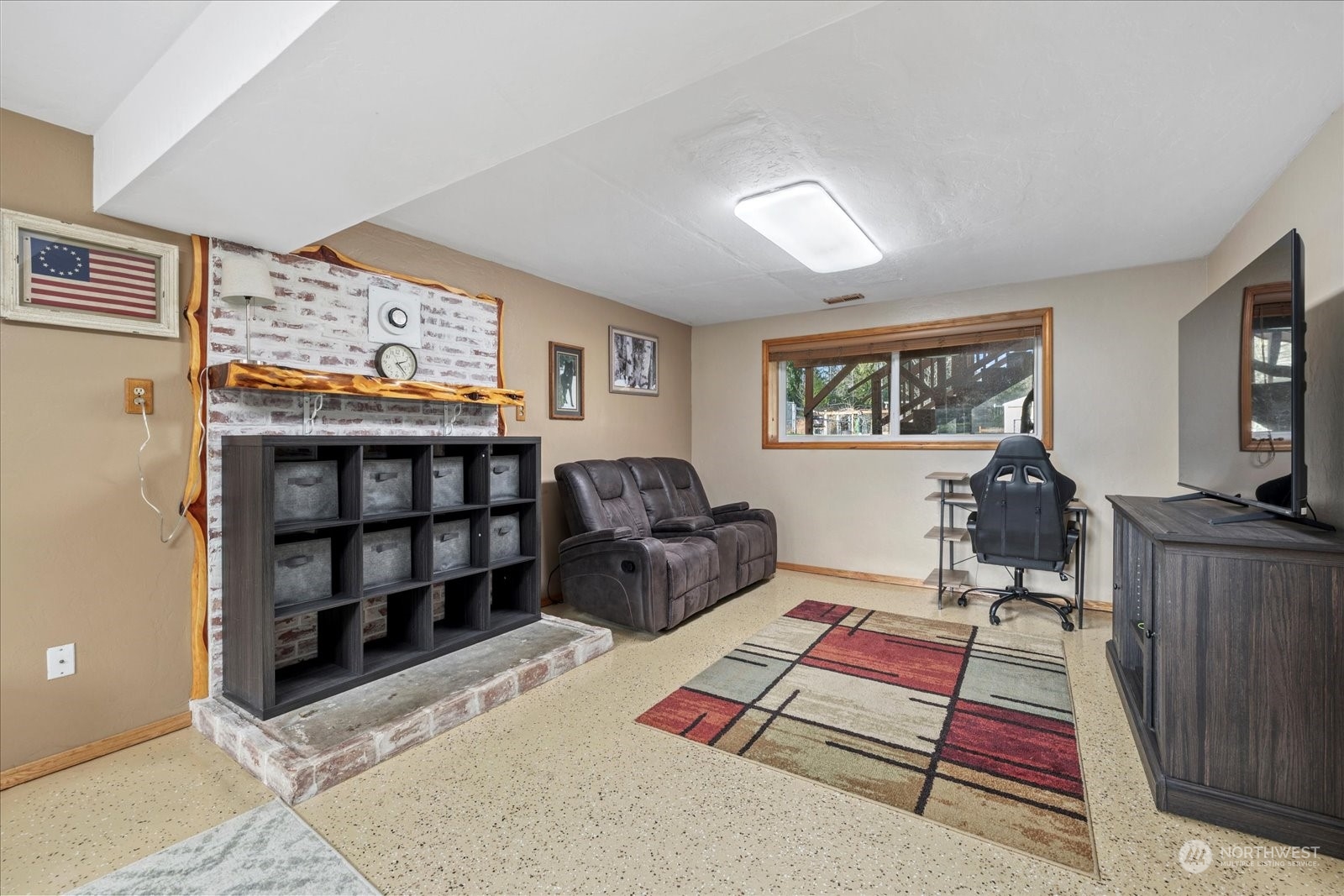 13925 Dubuque Road Snohomish, WA 98290 - Photo 21 of 40 a living room with furniture a rug and a flat screen tv
