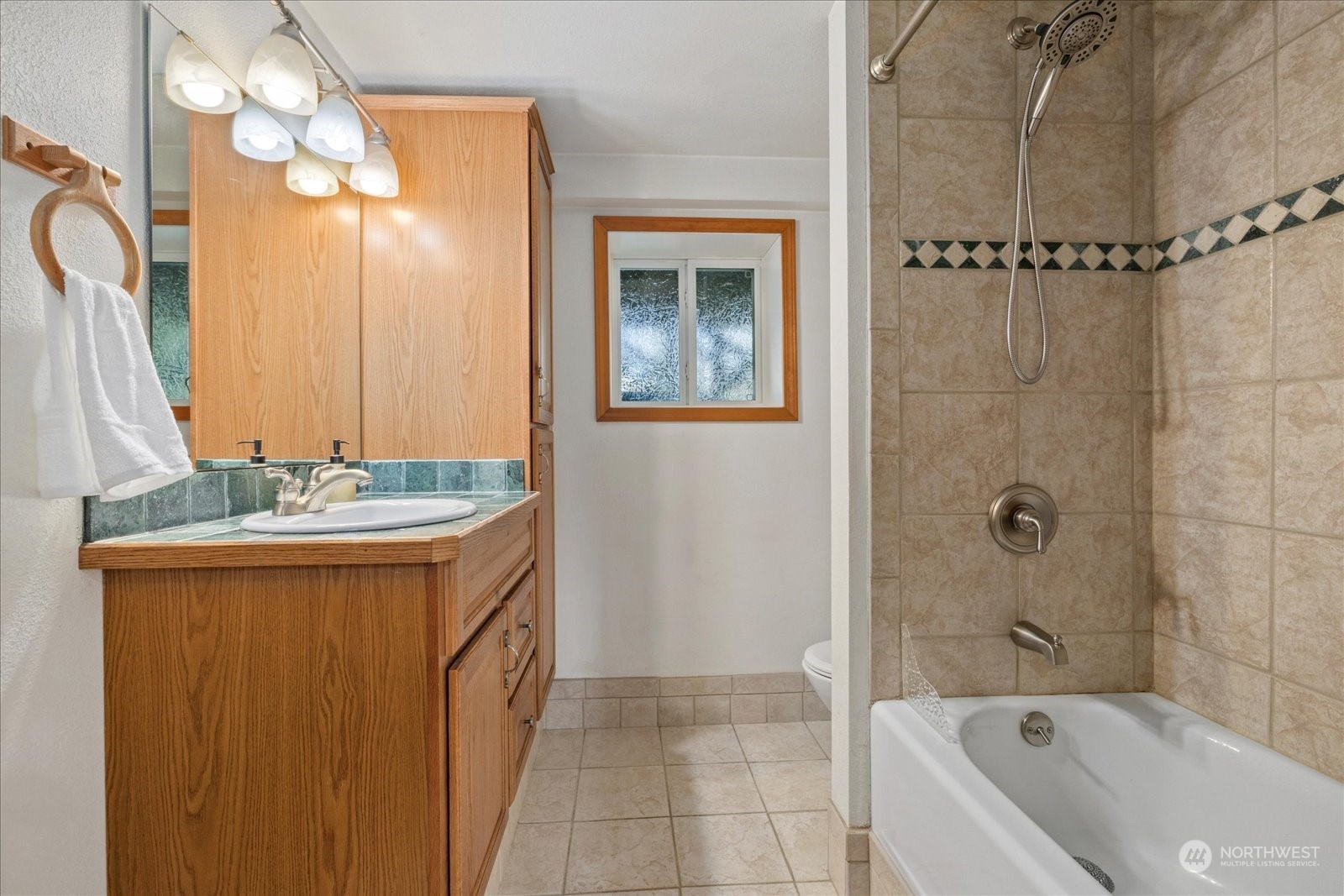 13925 Dubuque Road Snohomish, WA 98290 - Photo 24 of 40 a bathroom with a granite countertop sink a mirror and a bathtub
