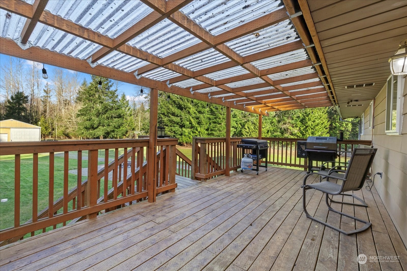 13925 Dubuque Road Snohomish, WA 98290 - Photo 28 of 40 a view of a chairs on wooden deck