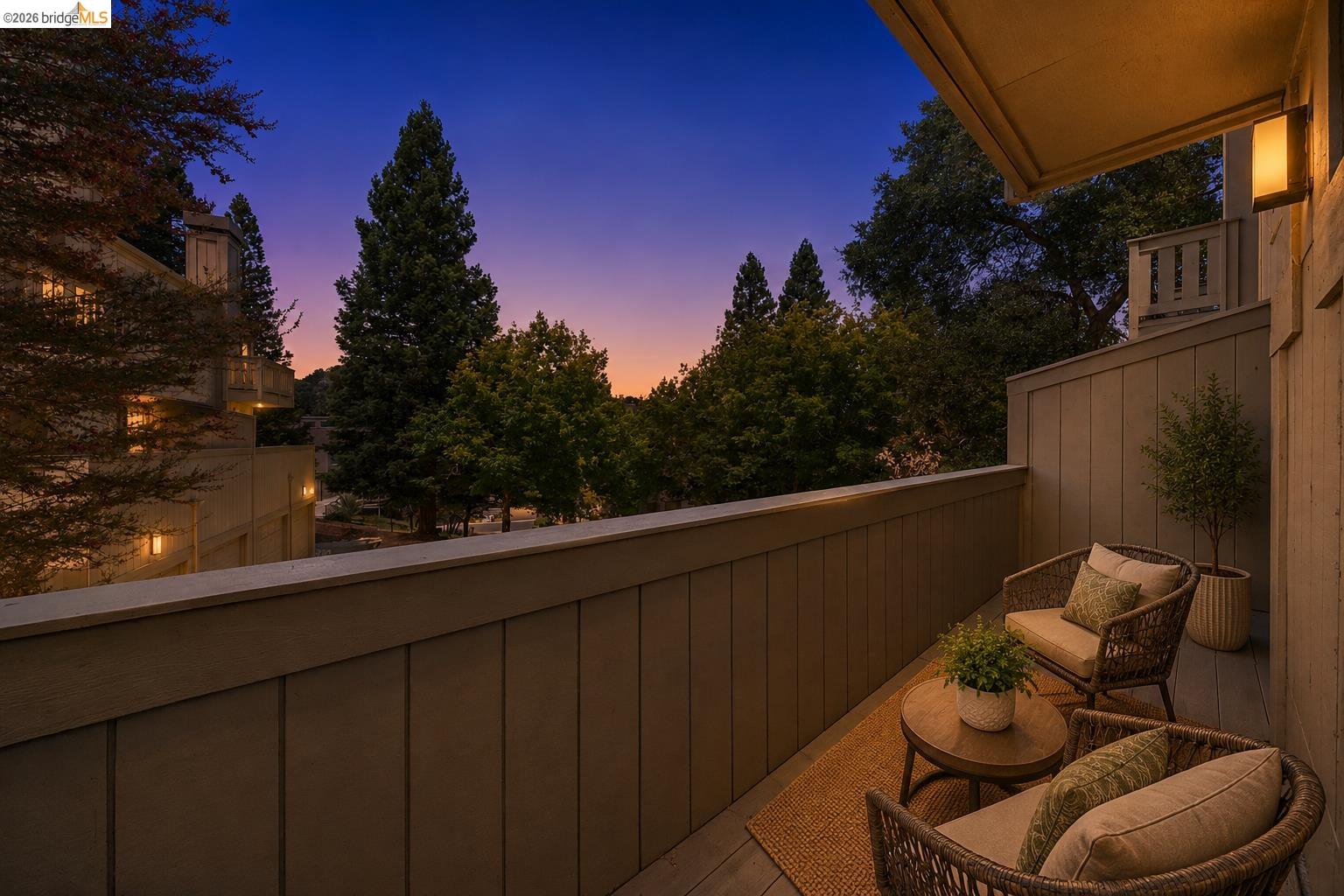 261 Redhawk Road Novato, CA 94949 - Photo 5 of 44 Private balcony with plank flooring, a solid railing, and architectural wall sconces